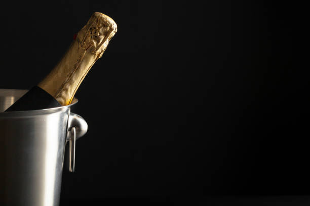 istock Champagne bottle on a black background 1150671156