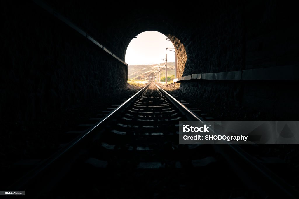 Light at the end of the tunnel railway Train - Vehicle Stock Photo