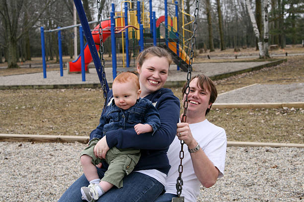 istock Young Family; swinging 115067192