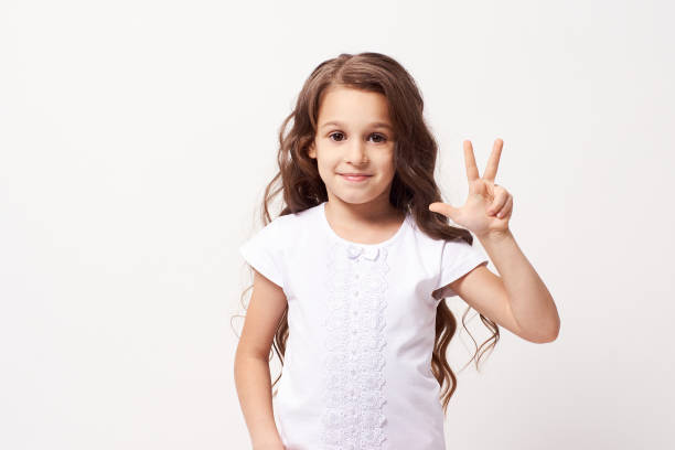 istock Brunette girl. Beautiful portrait. Light background 1150672484