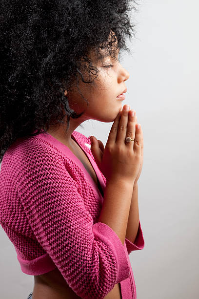 istock Innocent Little Girl Praying 115067510