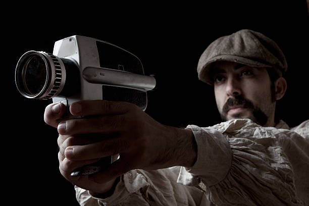 istock Actor Holding A Handcam As Handgun 115067816