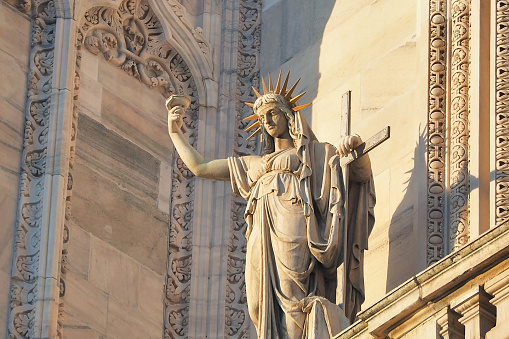 Italy - 23 June 2018: Statue on the Milan Cathedral's facade representing the New Law carved by Camillo Pacetti in 1810 in Milan city Italy