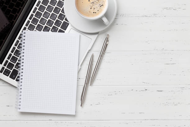 istock Office workplace with coffee, supplies and computer 1150683558