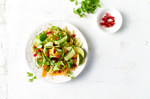 Cucumber, carrot , sugar pea and quinoa salad with pomegranate seeds