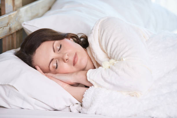 istock Young girl. Healthy sleep. White bed 1150689319
