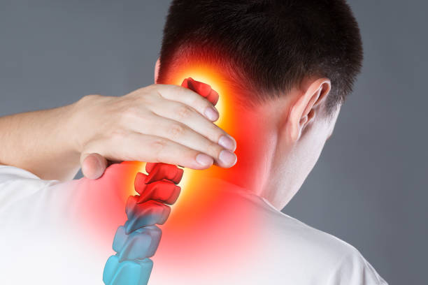 Pain in the spine, a man with backache, injury in the human neck, chiropractic treatments concept Pain in the spine, a man with backache, injury in the human neck, chiropractic treatments concept with highlighted skeleton cervical vertebrae photos stock pictures, royalty-free photos & images