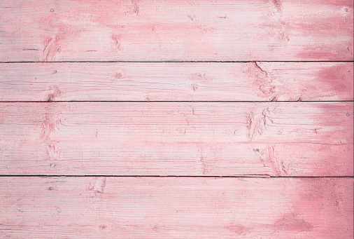wooden horizontal boards painted pink. pink wooden background.