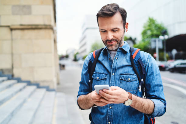 istock Portrait of man using smartphone while out in the city 1150689889