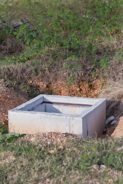 istock Concrete construction tube pipe. Building a road sewer drain system. Sewer construction. 1150690804