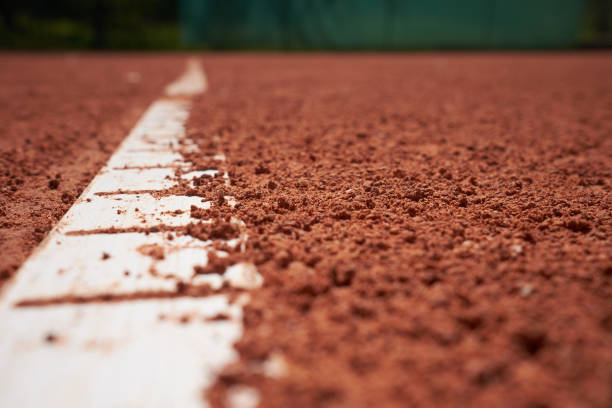 istock red sand tennis field with white line close background 1150691051
