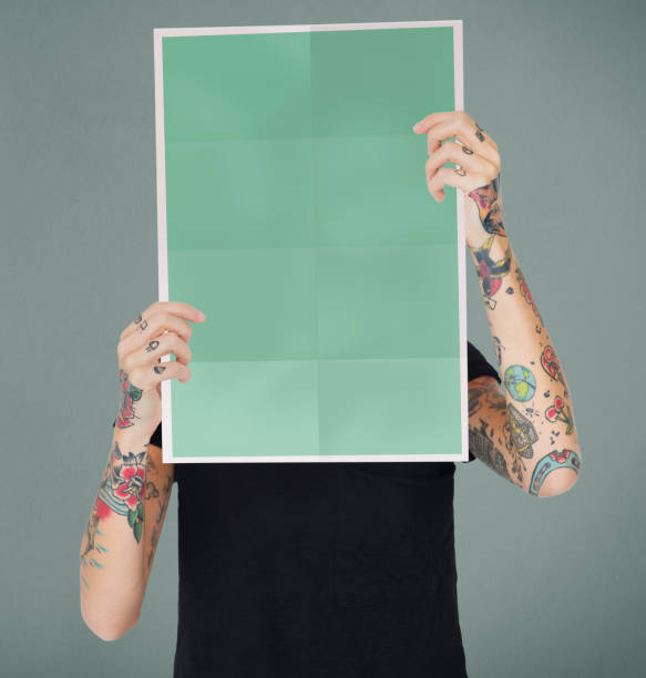istock Holding a blank piece of paper 1150691554