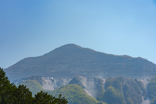 View of Mount Buko or Buko-zan, intensive mining left its scars on the mountain, in fact absolutely dominating the face of the mountain today. Chichibu city, Saitama Prefecture, Japan