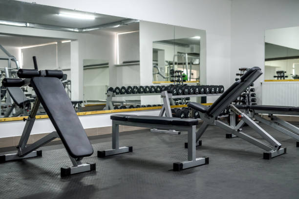 istock Modern interior of light gym with different equipment 1150693517