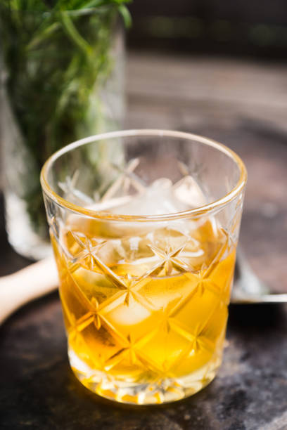 istock Old fahioned cocktail on the rustic background 1150694368