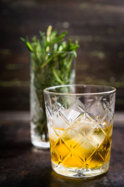 istock Old fahioned cocktail on the rustic background 1150694373