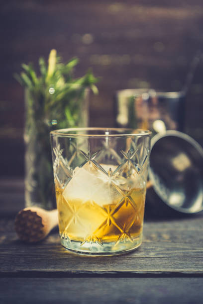 istock Old fahioned cocktail on the rustic background 1150694385
