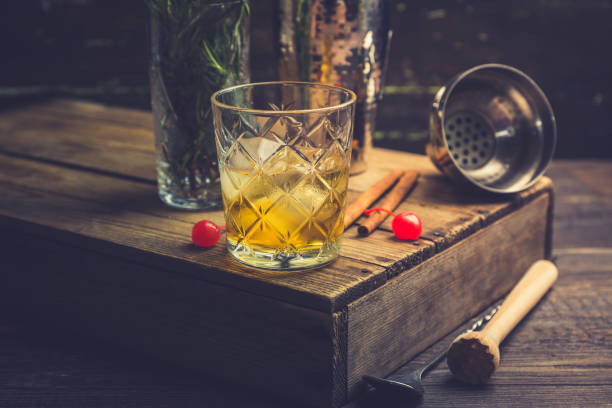istock Old fahioned cocktail on the rustic background 1150694387