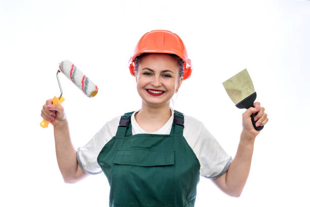 istock Woman with painting tools isolated on white 1150694667