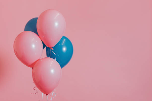 istock Pink and blue helium balloons 1150694750