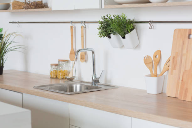 istock White kitchen Interior in scandinavian style with kitchenware and green plants 1150695722