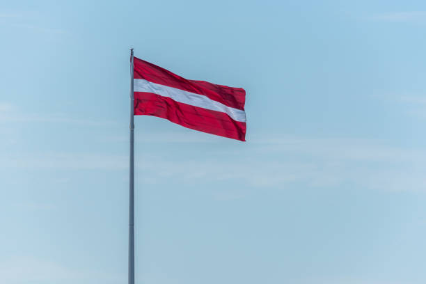 istock Latvian Flag on a Windy Day with a Sunny Sky 1150697830
