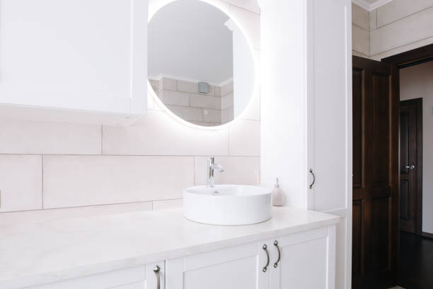 istock Minimalist bathroom with sink and mirror. Mirror with led backlight 1150698419