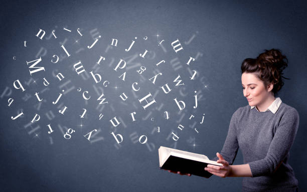 istock Young lady holding book with letters 1150698605