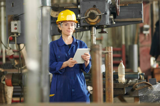 istock Smiling Woman Using Tablet at Plant 1150700078