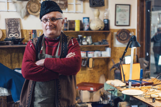 istock Senior adult carpenter at his studio 1150700883