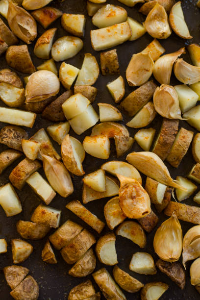 istock Roasted Potatoes Close Carlic Cloves 1150702140