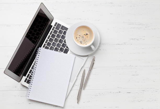 istock Office workplace with coffee, supplies and computer 1150702615