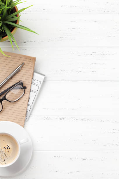 istock Office workplace with coffee, supplies and computer 1150702726