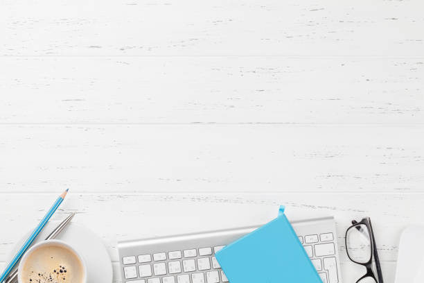 istock Office workplace with coffee, supplies and computer 1150702782