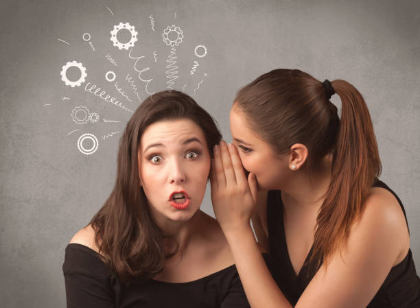 istock girl telling secret things to her girlfriend 1150703478