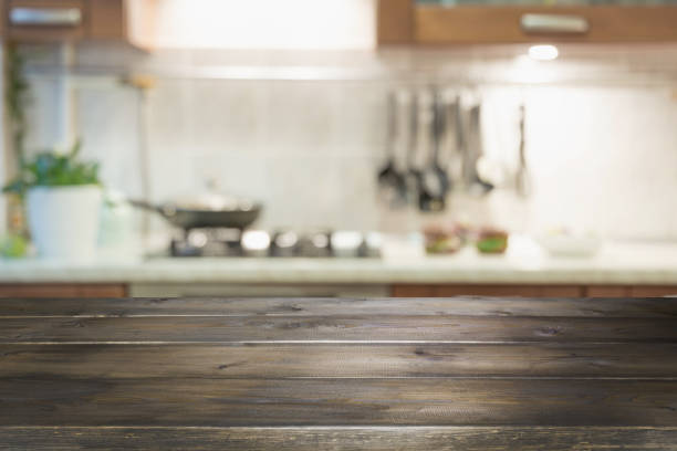 istock Blurred abstract background. Modern kitchen with tabletop and space for display your products. 1150704937