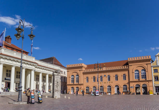 Schwerin, Germany - April 16, 2019: Orange town hall at he market square in Schwerin, Germany