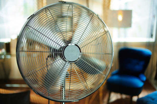 istock Closeup on working electric floor standing fan 1150706632