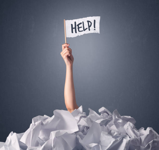 istock Female hand holding help sign 1150707889