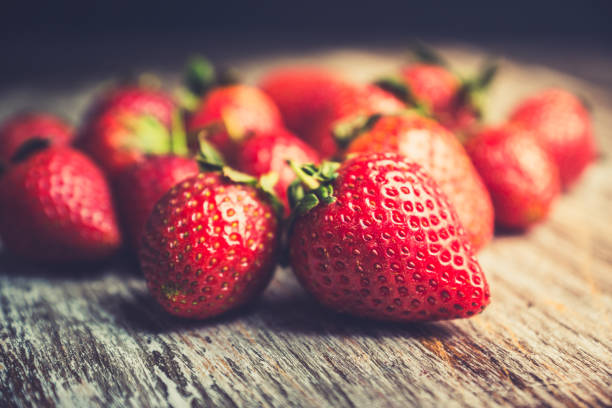 istock Ripe strawberries on the rustic background 1150708325