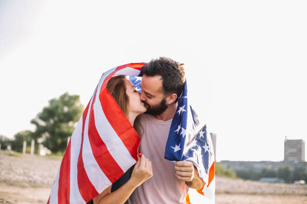 istock Happy couple under stars and stripes flag 1150710663