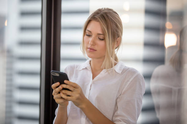 istock Businesswoman Using Mobile Phone In Office 1150710731