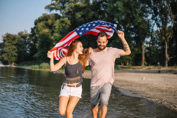istock Happy couple under stars and stripes flag 1150710986