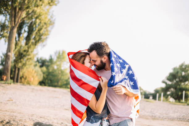 istock Happy couple under stars and stripes flag 1150711065