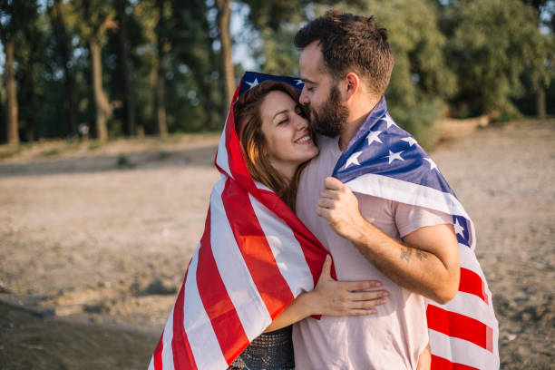 istock Happy couple under stars and stripes flag 1150711336