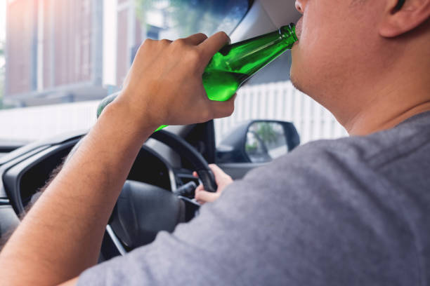 istock Midsection Of Man Drinking Beer While Sitting In Car 1150711409