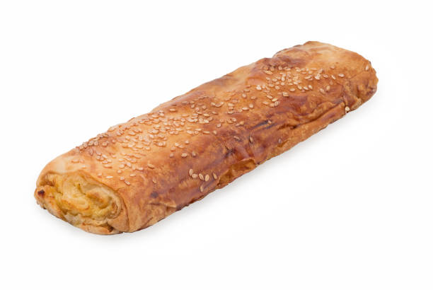 istock Baking puff pastry with potatoes and sesame. Isolated on white background 1150711710