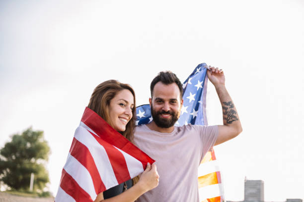 istock Happy couple under stars and stripes flag 1150711889