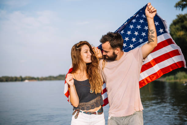 istock Happy couple under stars and stripes flag 1150711987