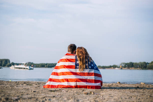 istock Happy couple under stars and stripes flag 1150711991